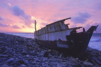 Wrecked fishing boat at sunrise, Bonaire. Fuji Velvia fil... by Andrew Jalbert 
